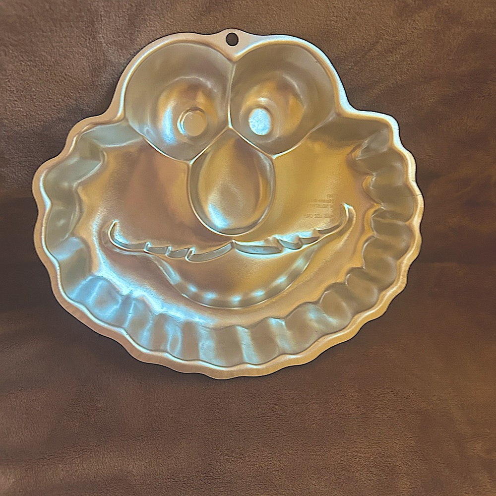 This cake pan is Elmo from Sesame Street that’s been used once and washed.